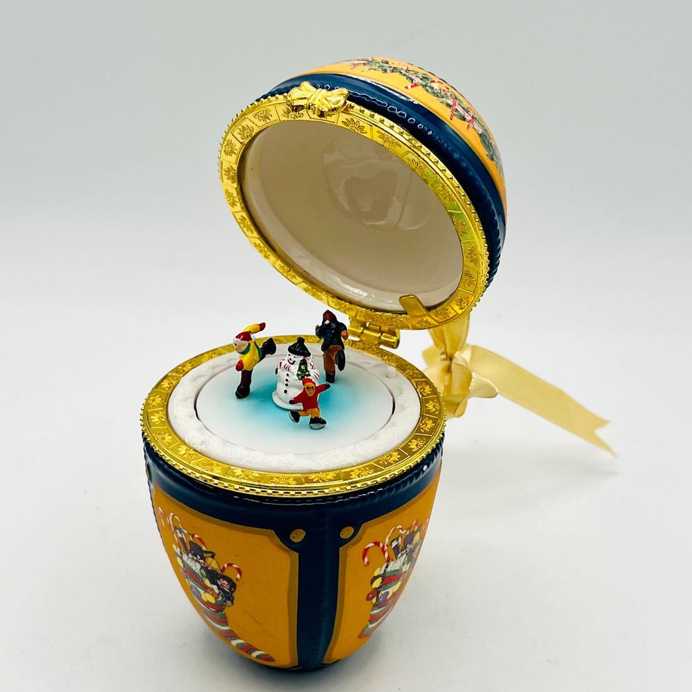 Sankyo Musical Christmas Egg Ornament Ice Skaters Snowman Hinged Porcelain